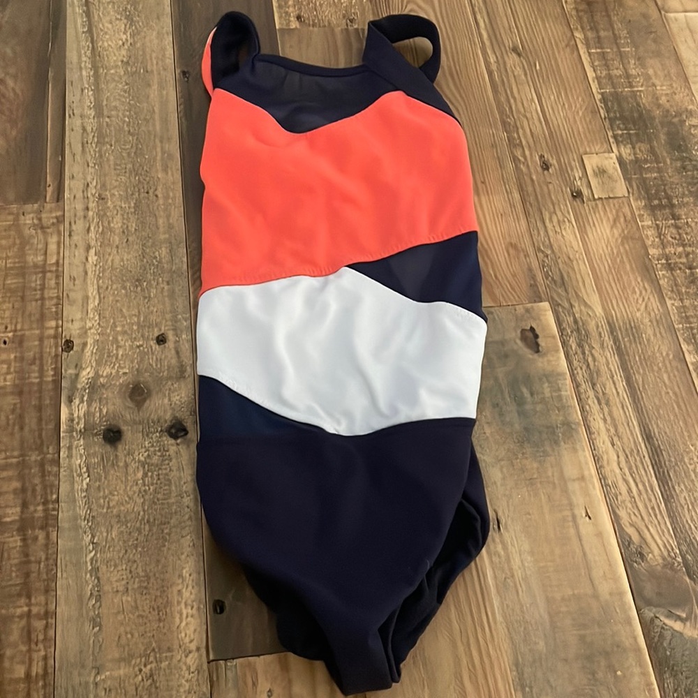 This is a multicolored leo from Five Dance-wear. It’s a size YXL.